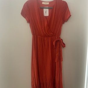 Women orange and white polka dot dress. New with tags.